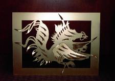 Metal Carolina Gamecock in frame painted gold.