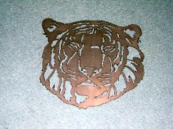 Tiger silhouette made from metal at plasma designs for art.